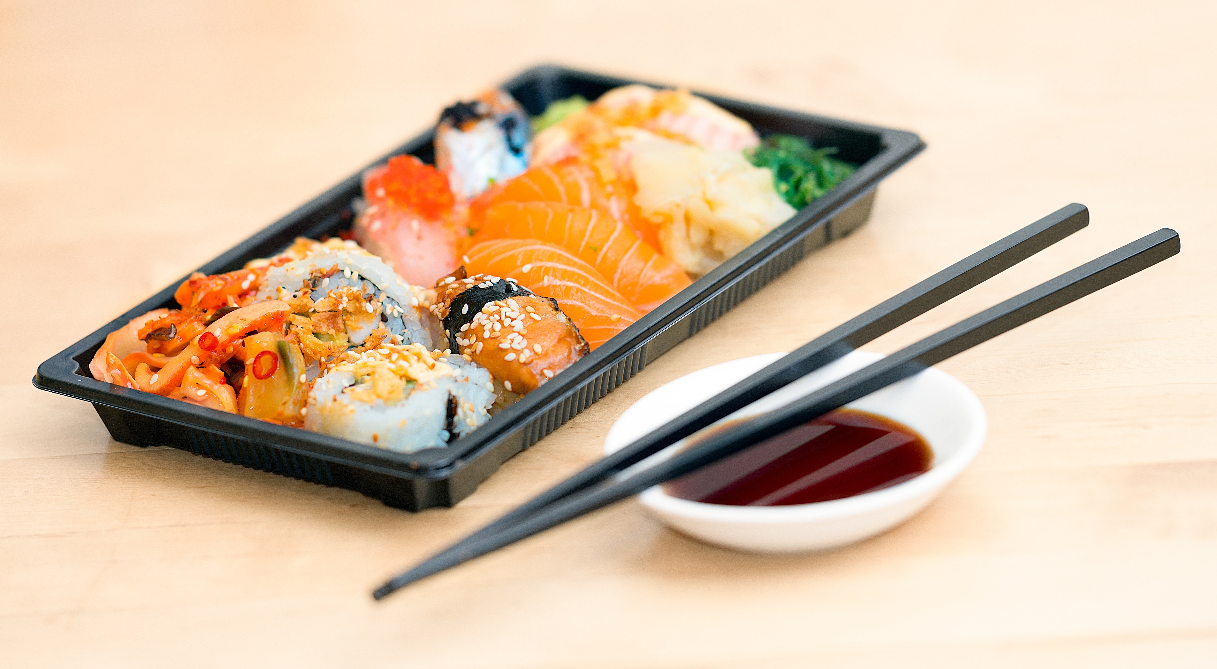 A take-away tray with delisious pieces of sushi